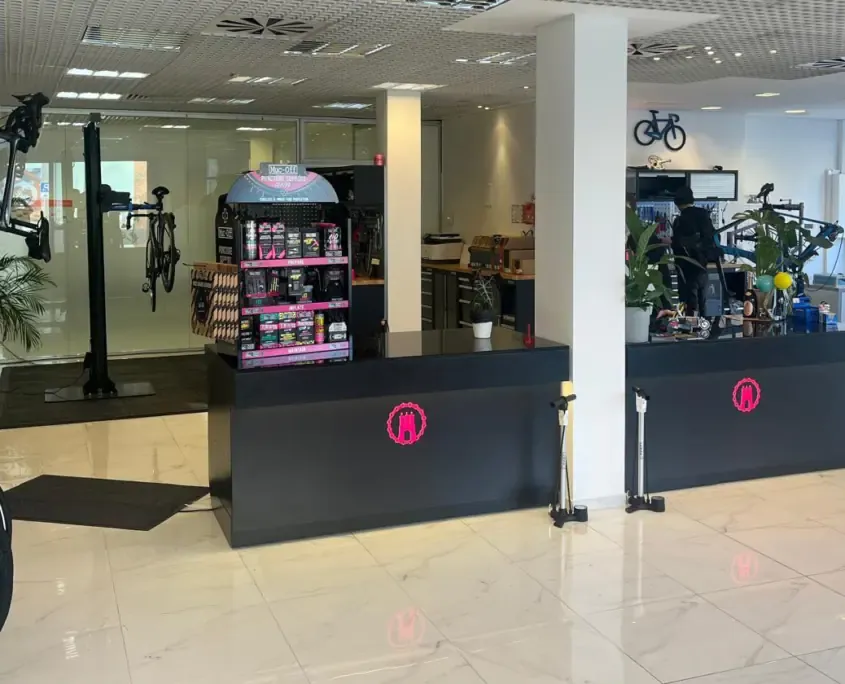 A view into the bicycle workshop with counters and bicycles.